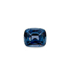 A cushion-cut blue spinel gemstone with a faceted square shape, centered on a plain white background.
