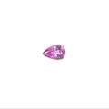 A pear-cut pink gemstone with faceted cuts, centered on a solid white background.